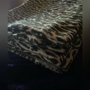 I am selling 3 , 773 studio pillow covers green and tan animal print